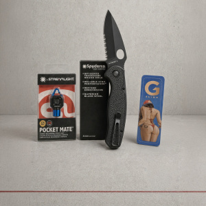 Spyderco Autonomy 2 automatic knife with box, Streamlight Pocket Mate, and Q G-Sling package on a gray Thin Red Line Tactical backdrop